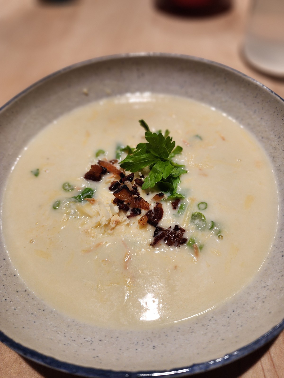 A creamy soup with bacon, cheese, and herbs